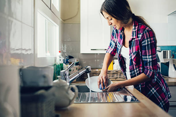 woman washing dishes.